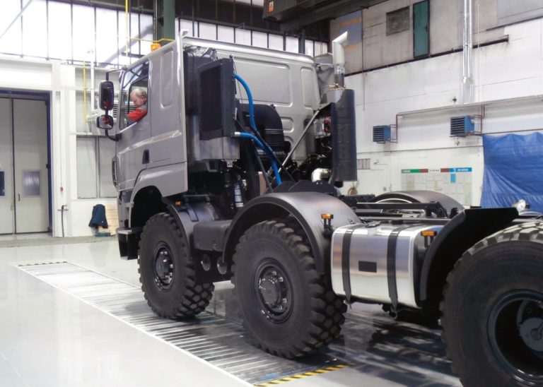 HGV driving over a service pit closed by its cover